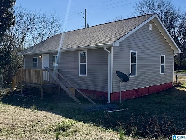 rear view of house with a yard