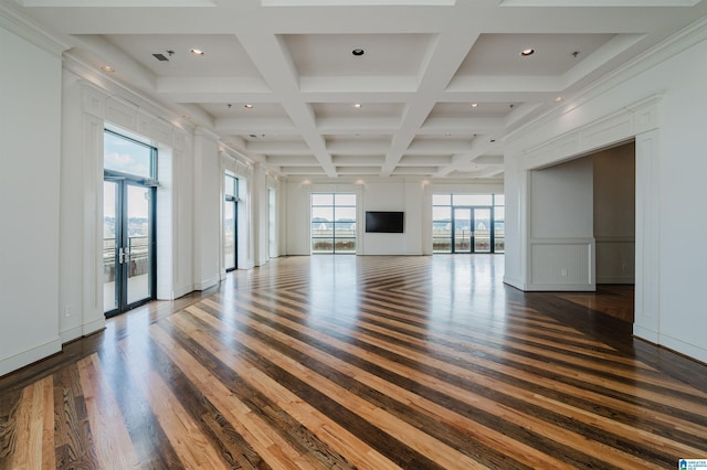 unfurnished living room featuring beam ceiling, dark hardwood / wood-style floors, french doors, and coffered ceiling