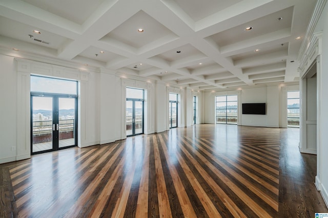 unfurnished living room with coffered ceiling, french doors, dark wood-type flooring, and beam ceiling