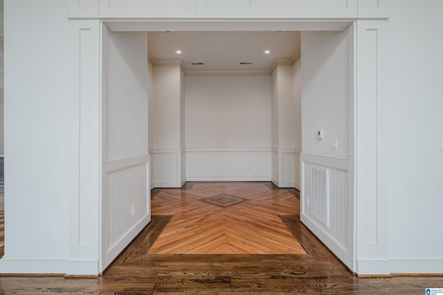 hallway featuring ornamental molding