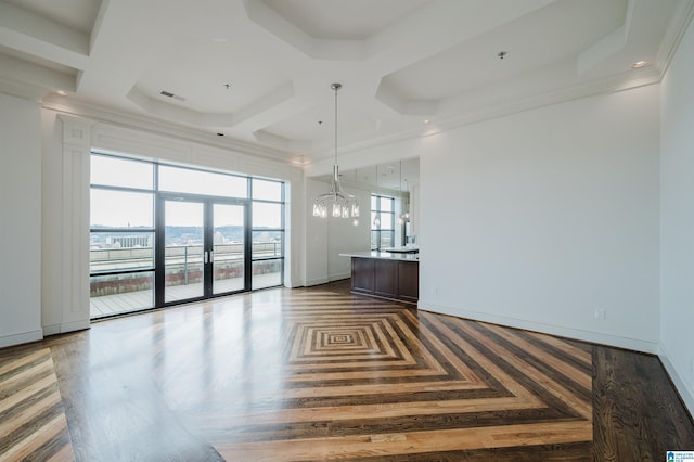 spare room featuring coffered ceiling, french doors, and beamed ceiling