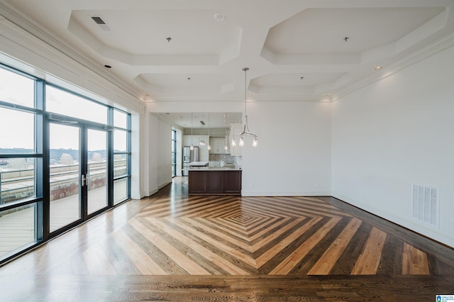 unfurnished living room featuring hardwood / wood-style floors and french doors