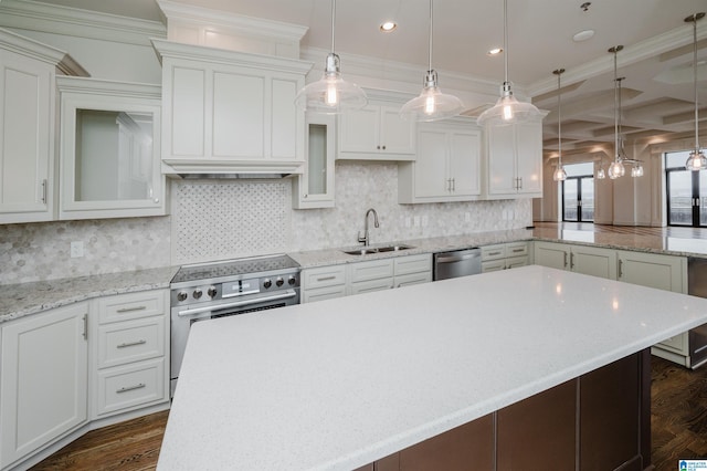 kitchen with sink, white cabinetry, decorative light fixtures, stainless steel appliances, and dark wood-type flooring