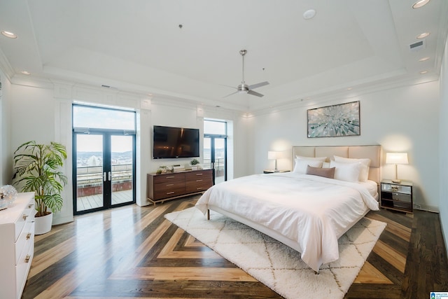 bedroom featuring french doors, parquet floors, access to exterior, ornamental molding, and a raised ceiling