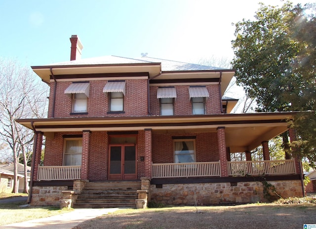 view of front of property featuring covered porch