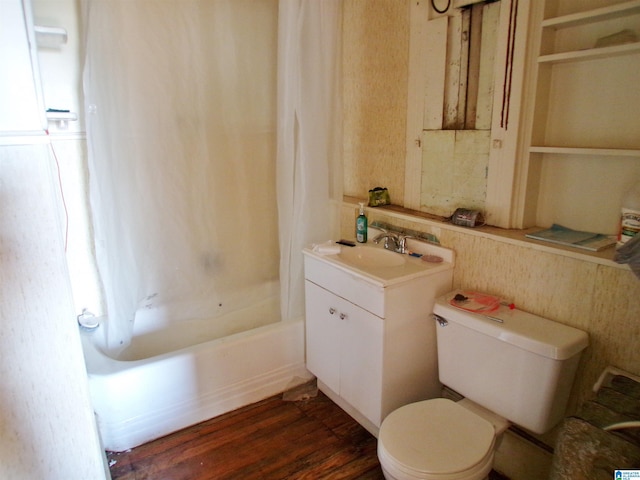 full bathroom featuring wood-type flooring, toilet, vanity, and shower / bath combo