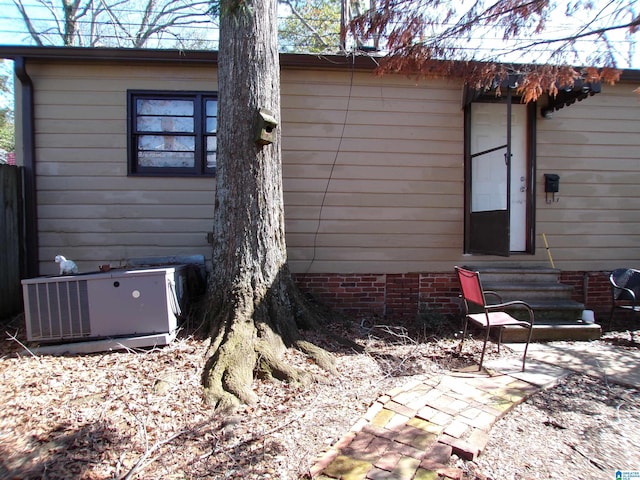 back of property with central AC unit