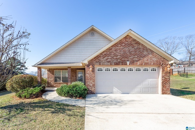 view of front of home with a garage and a front yard