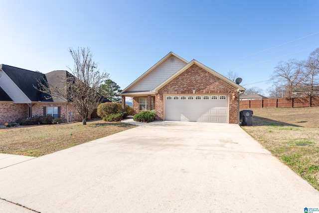 view of front of house with a garage and a front lawn