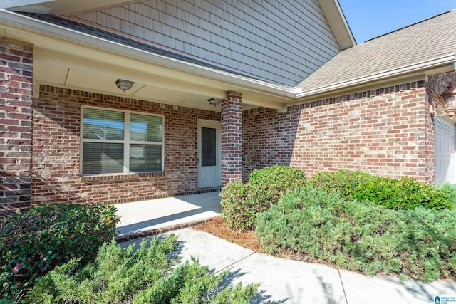 entrance to property with a patio