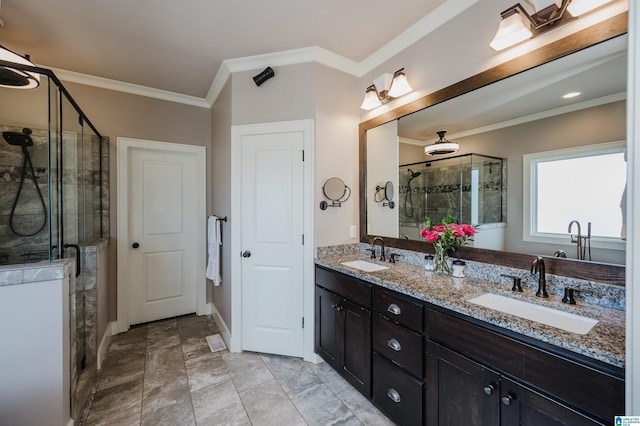 bathroom with crown molding, vanity, and walk in shower