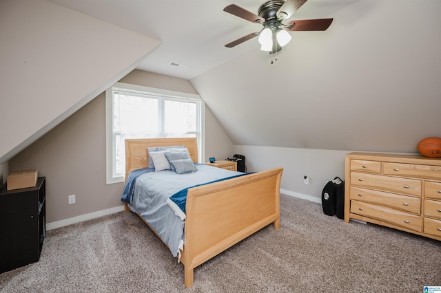 bedroom with lofted ceiling, carpet flooring, and ceiling fan