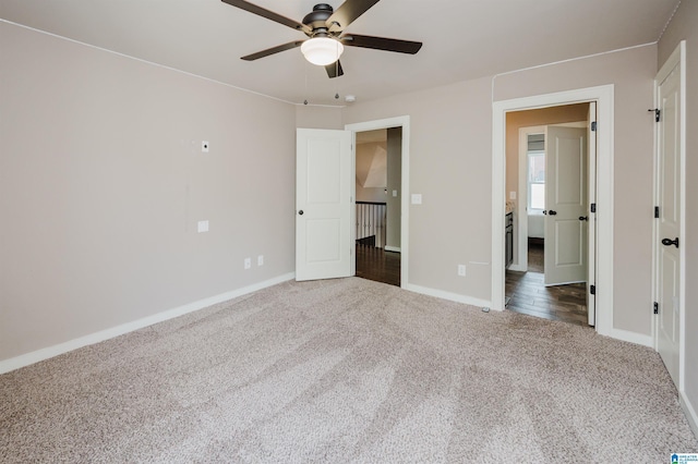 unfurnished bedroom with ceiling fan and carpet flooring