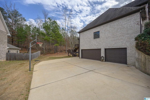 view of side of home with a garage