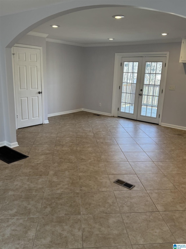 tiled spare room with french doors and ornamental molding