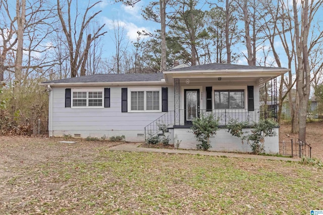 view of front of property with a porch and a front yard