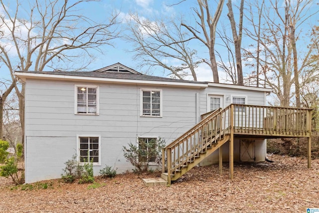 back of property featuring a deck