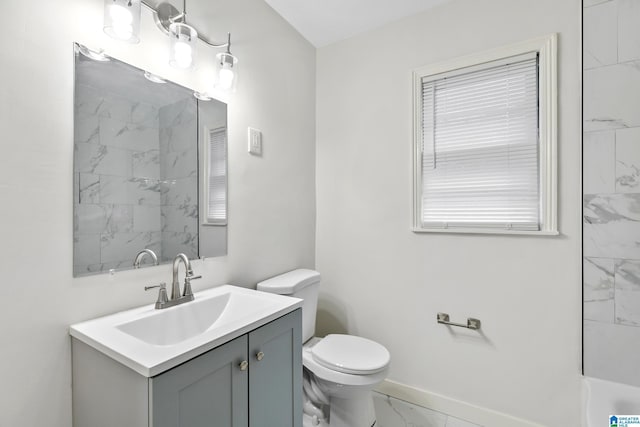 full bathroom with marble finish floor, vanity, toilet, and baseboards