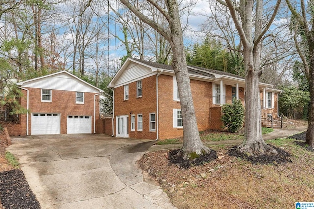 view of property exterior featuring a garage, driveway, and brick siding