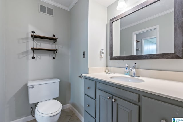 bathroom with toilet, vanity, visible vents, baseboards, and ornamental molding