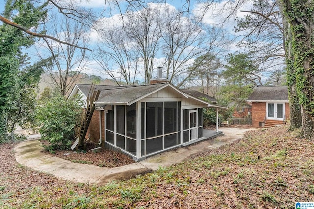 back of house featuring brick siding