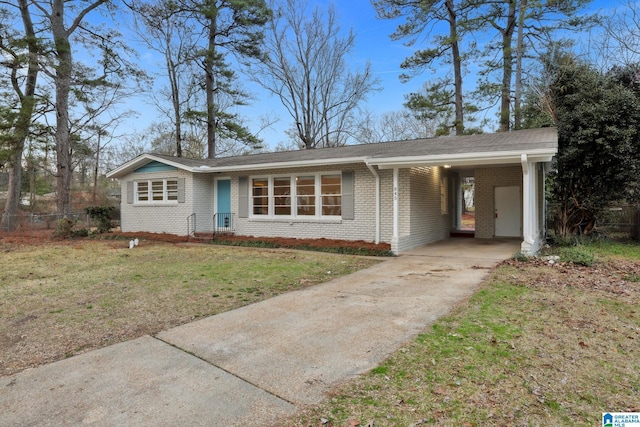 ranch-style home featuring a carport and a front yard