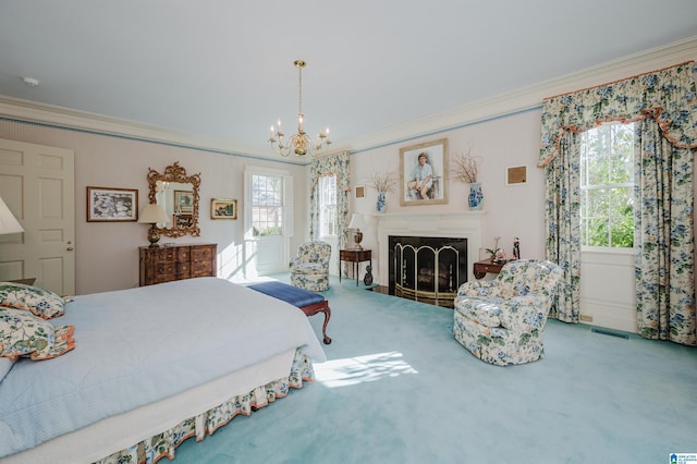 bedroom featuring crown molding, a chandelier, and carpet