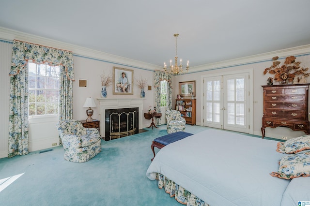 bedroom featuring multiple windows, ornamental molding, carpet, and access to outside