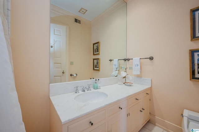 bathroom featuring crown molding, vanity, and toilet