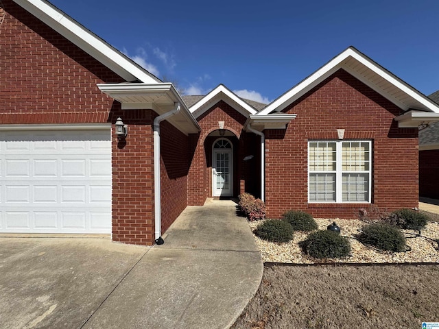 view of front of home featuring brick siding and an attached garage