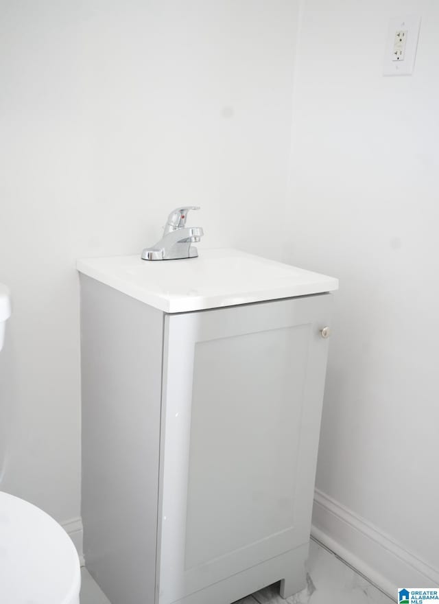 bathroom with vanity and toilet