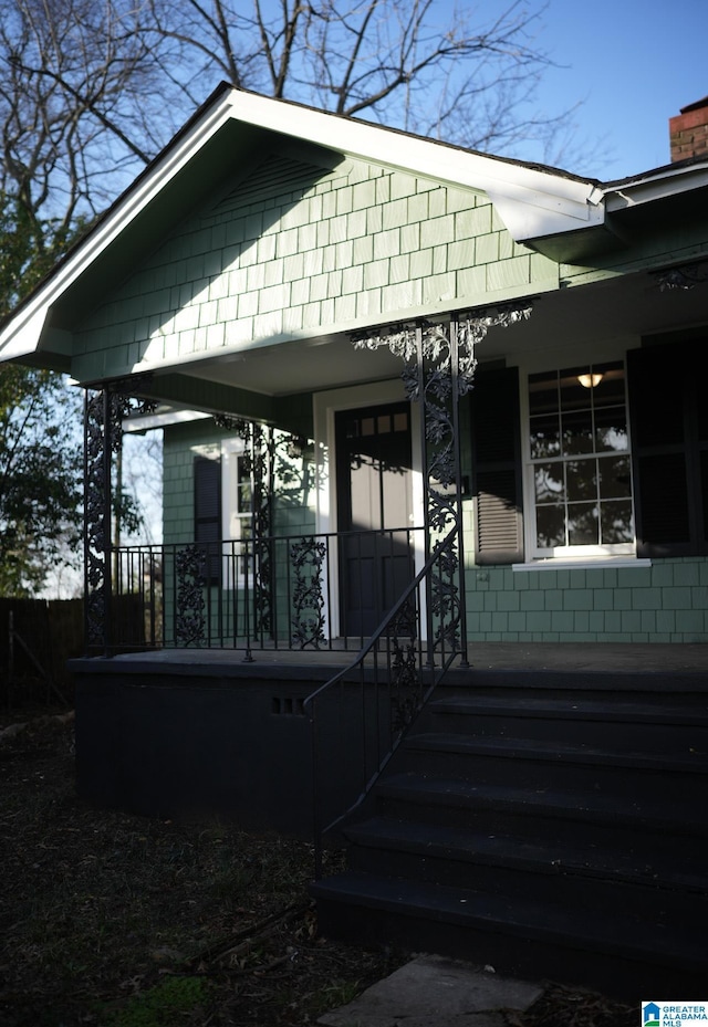 property entrance with covered porch