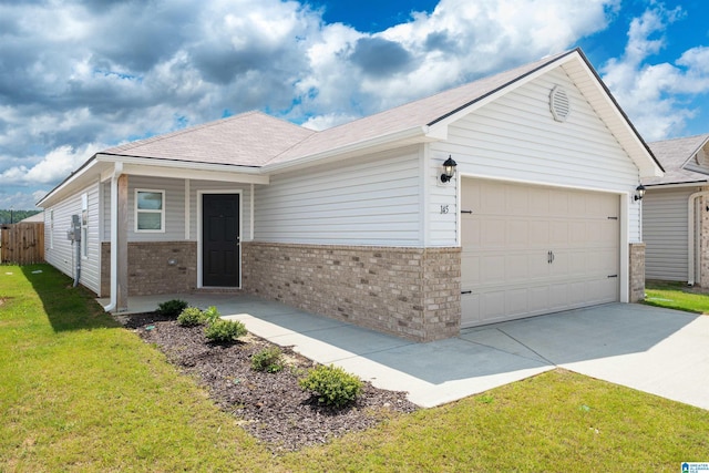 single story home featuring a garage and a front yard