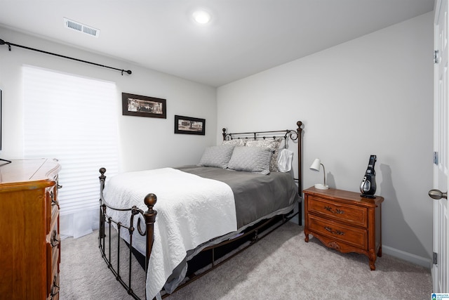 bedroom with light carpet