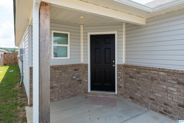 doorway to property with a patio area