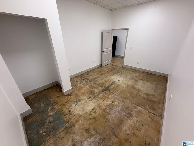 unfurnished bedroom with a drop ceiling