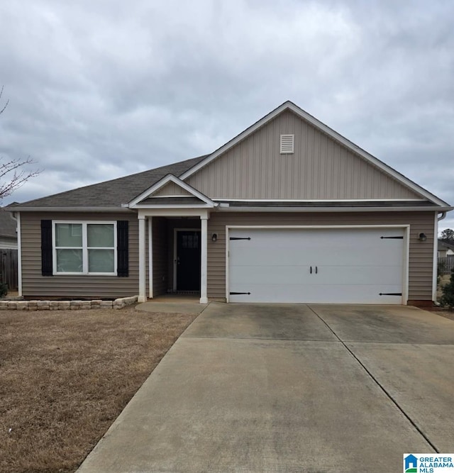 ranch-style home with a garage and driveway