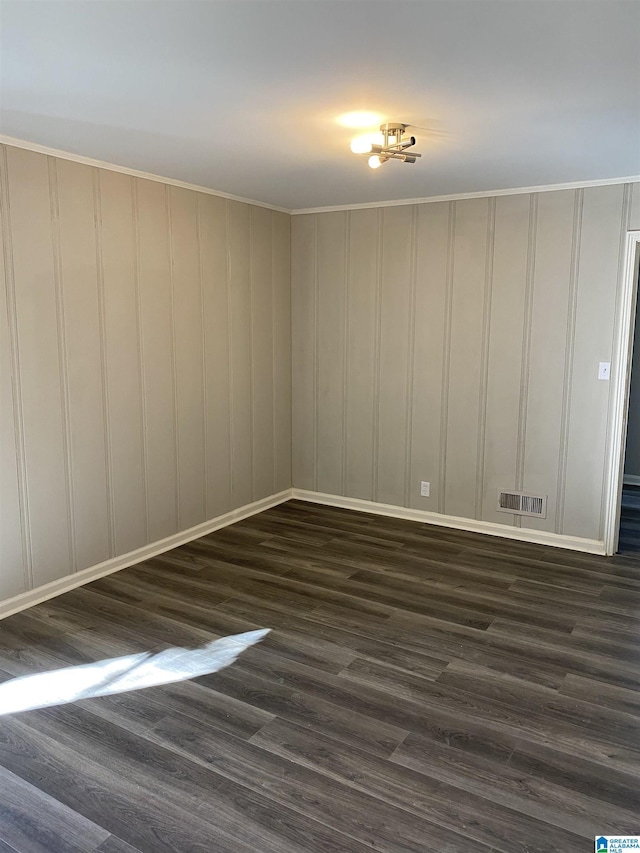 empty room featuring dark wood-type flooring