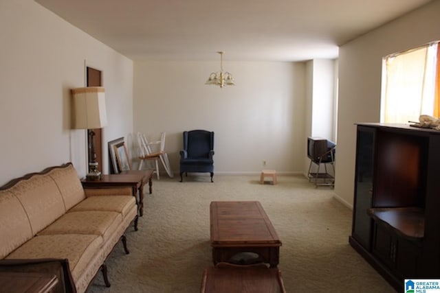 carpeted living room with a notable chandelier