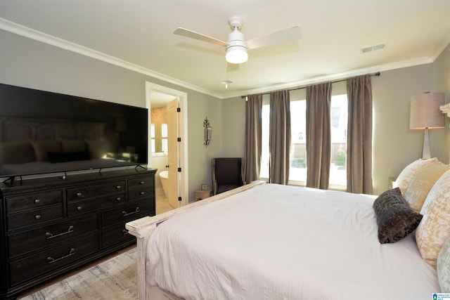 bedroom featuring light wood-style floors, ceiling fan, visible vents, and crown molding