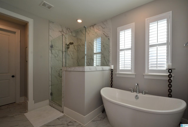 full bath with a marble finish shower, baseboards, visible vents, marble finish floor, and a freestanding tub