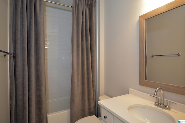 full bath with vanity, toilet, and shower / bath combo with shower curtain