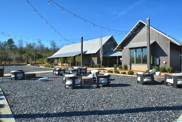 back of property featuring metal roof