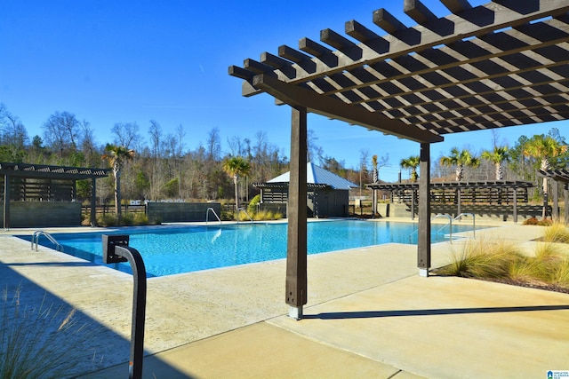 community pool featuring fence and a pergola