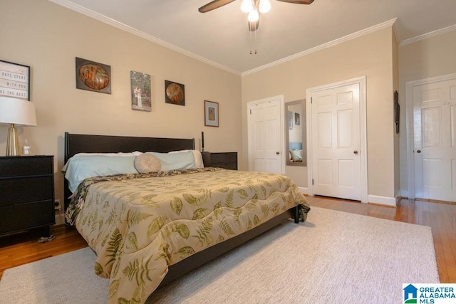 bedroom featuring hardwood / wood-style flooring, ceiling fan, and crown molding