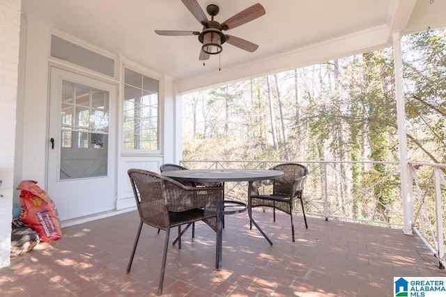 sunroom featuring ceiling fan