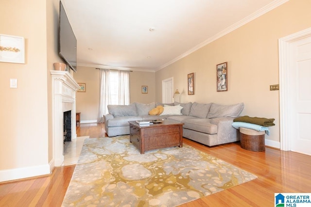 living room with hardwood / wood-style flooring and crown molding