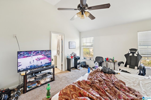 carpeted bedroom with multiple windows, vaulted ceiling, and ceiling fan