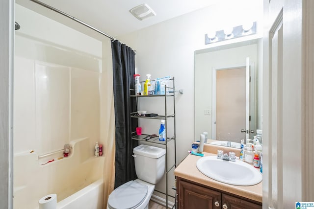 full bathroom featuring toilet, vanity, and shower / tub combo