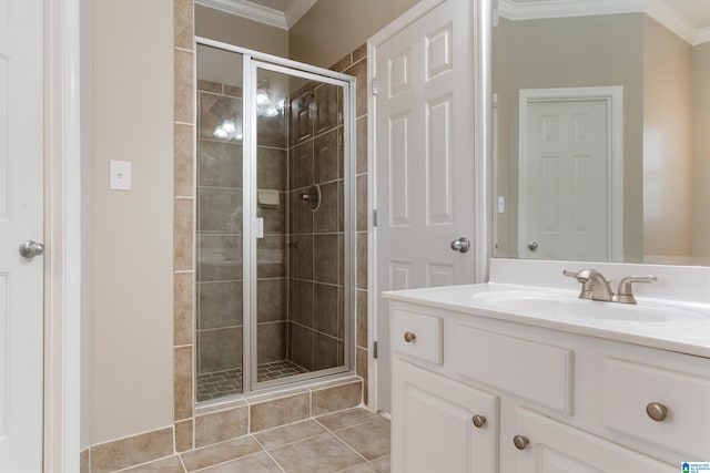 bathroom featuring tile patterned floors, crown molding, vanity, and a shower with door